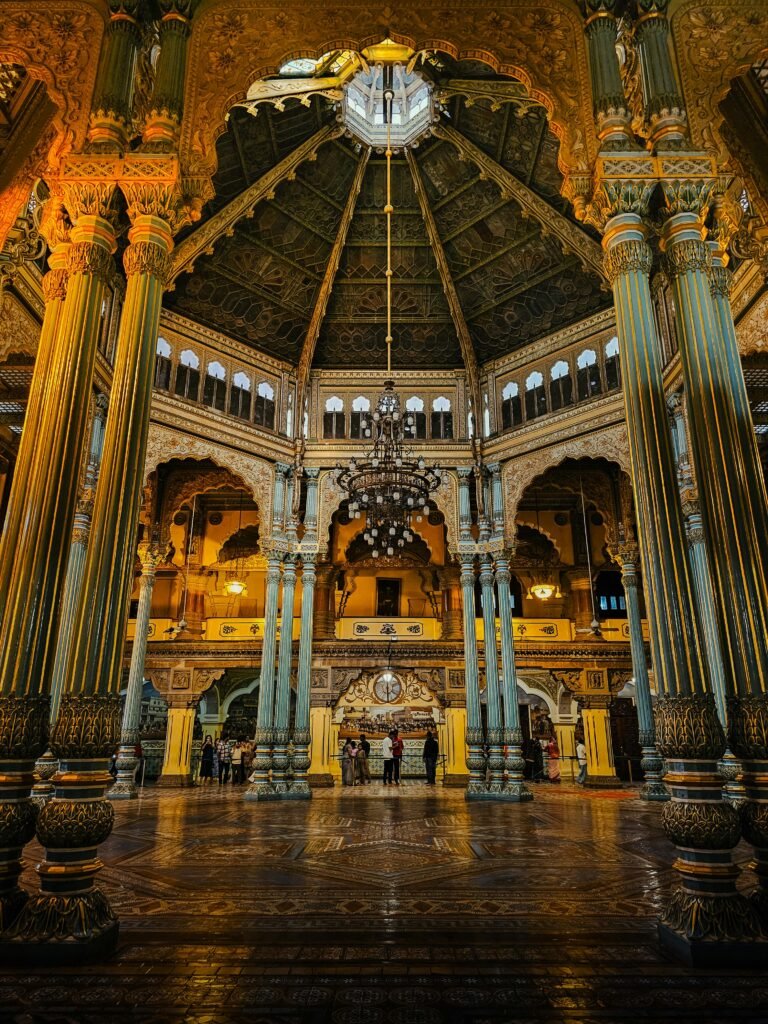 Interior view of the grand Mysore Palace showcasing intricate Indo-Saracenic architecture.